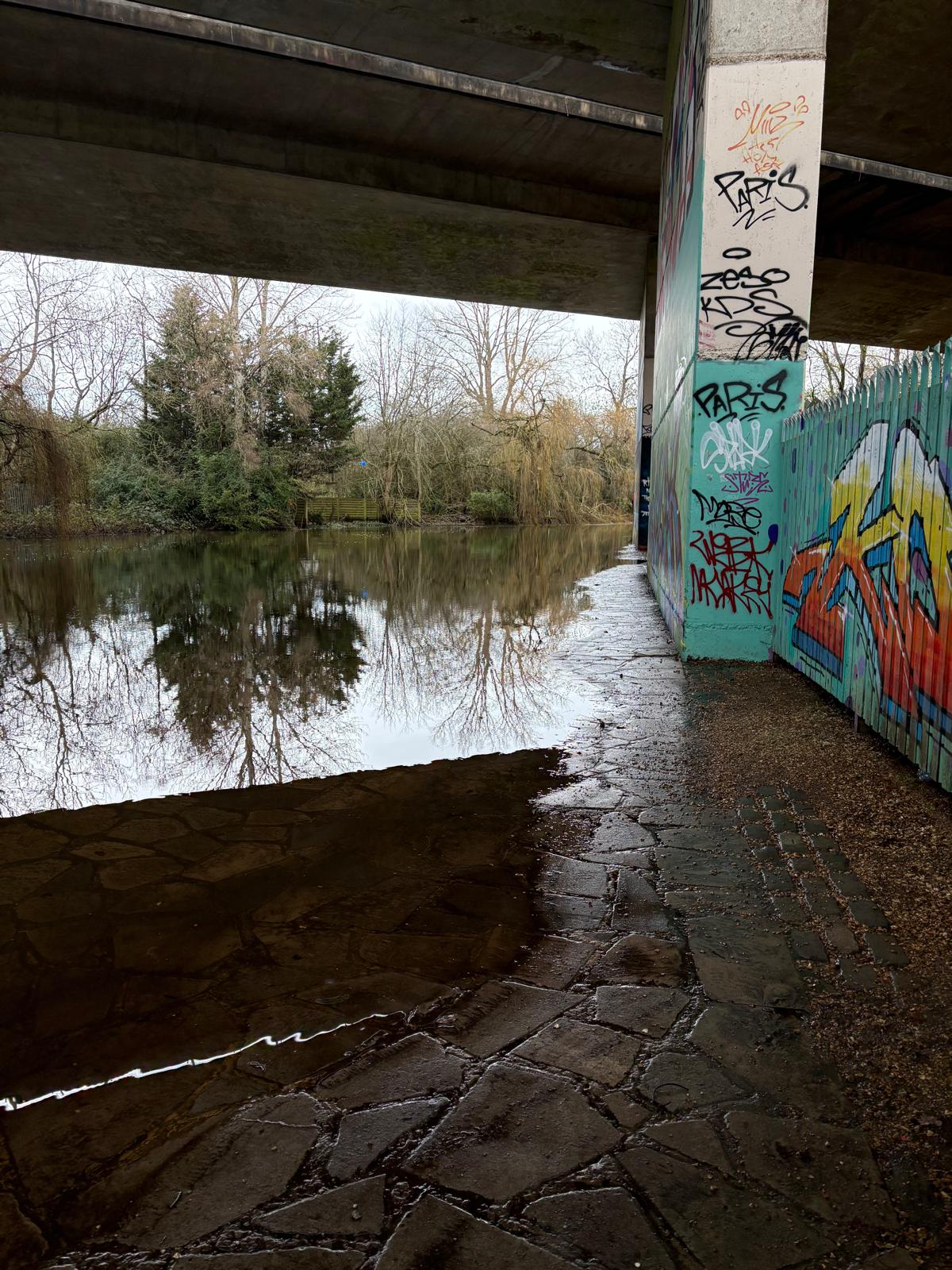 Under the A325M, there is a narrow paved area above the water.